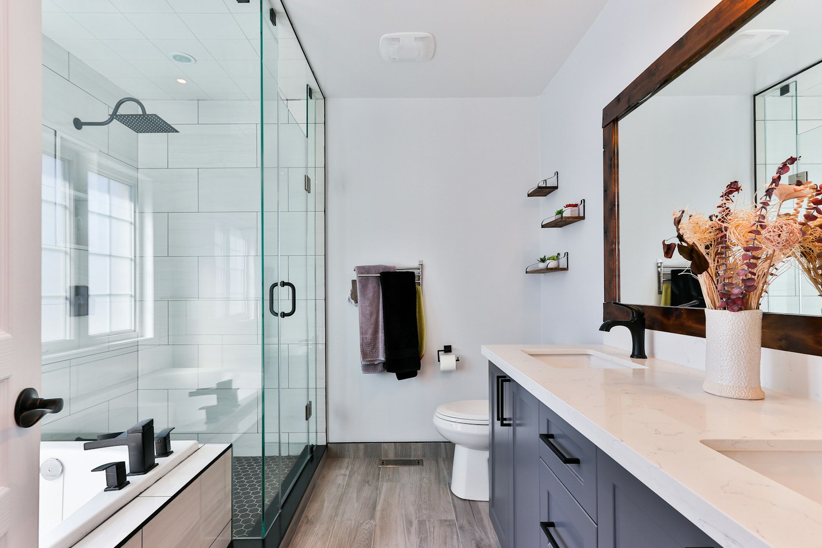 Remodeled bathroom with a tiled shower and new vanity
